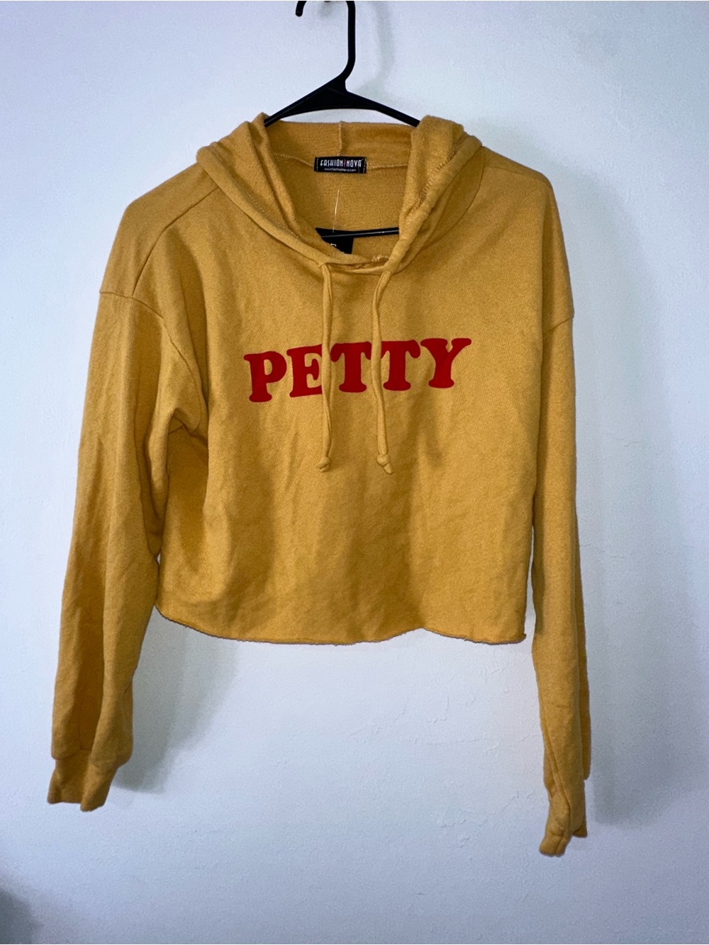Fashion Nova Cropped Hoodie in Mustard Yellow with Red PETTY Logo